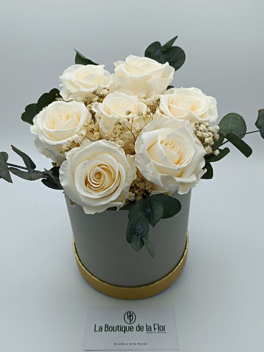 Candy box with eternal champagne-colored roses and preserved flowers.