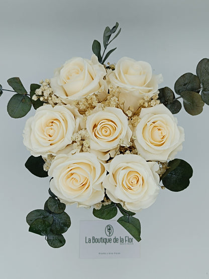 Candy box with eternal champagne-colored roses and preserved flowers.