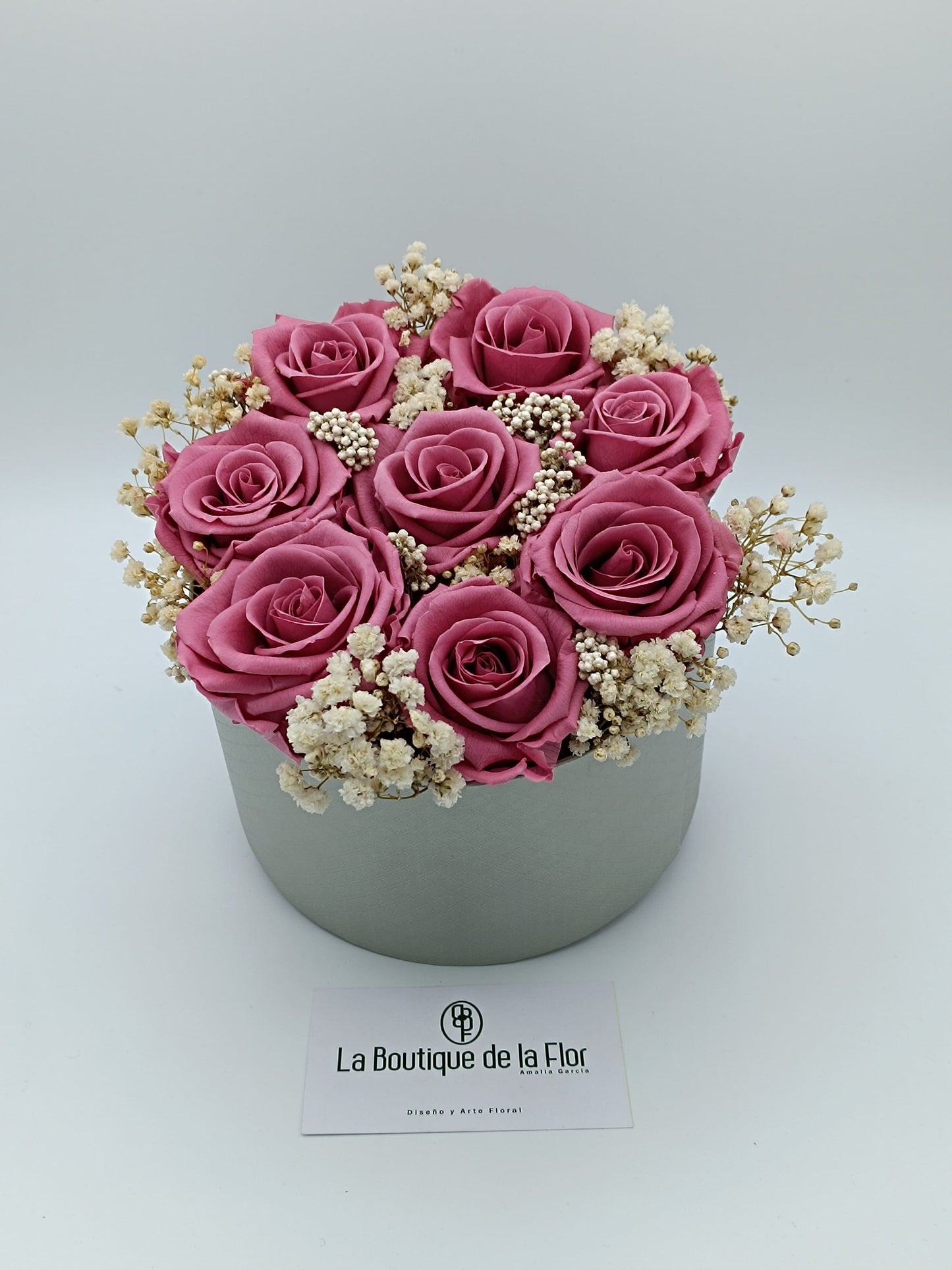 Candy box with eternal vintage pink roses and preserved flowers.