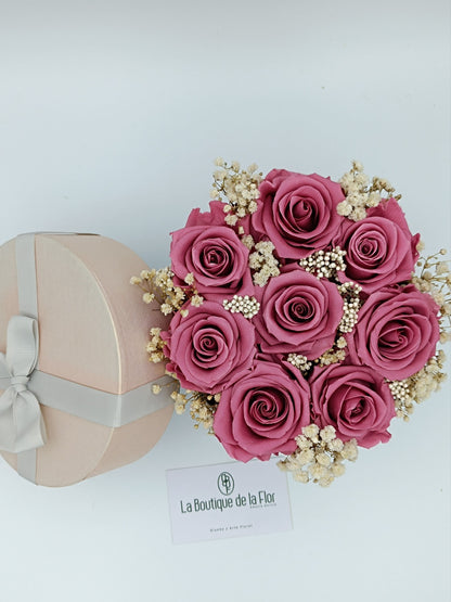 Candy box with eternal vintage pink roses and preserved flowers.