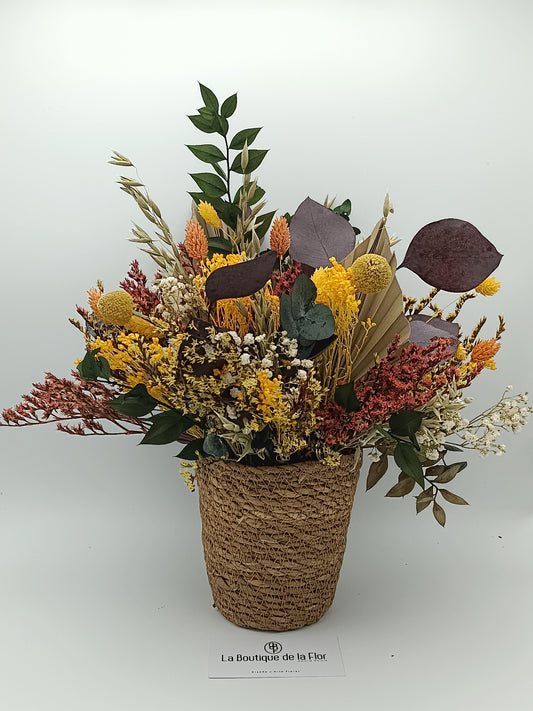 Basket preserved flowers in yellow tones.