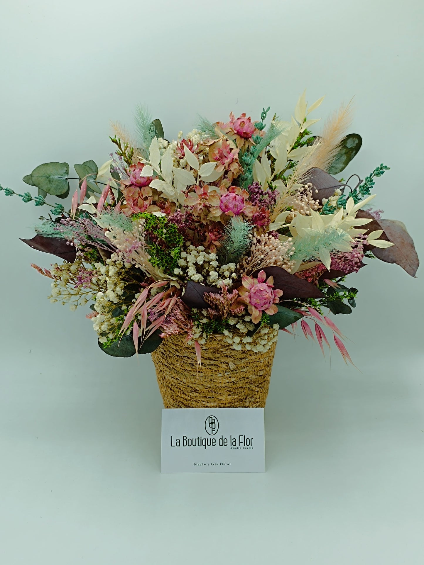 Basket preserved flowers in pink tones